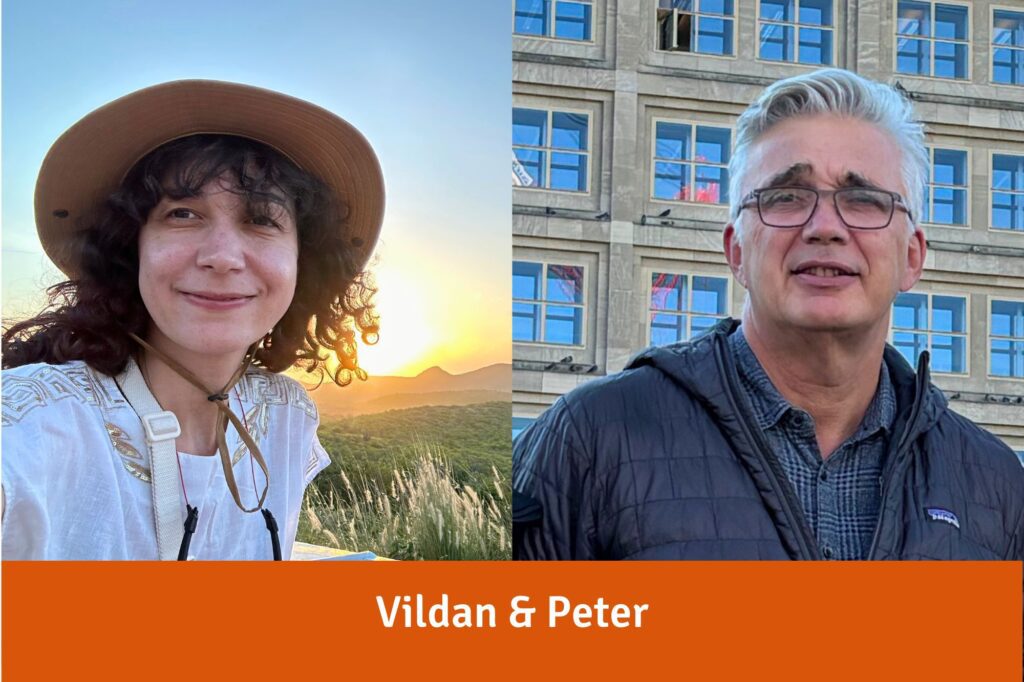 Vildan, eine junge Frau mit lockigem dunklem Haar und Strohhut, und Peter, ein Mann mit grauem Kurzhaarschnitt und Brille